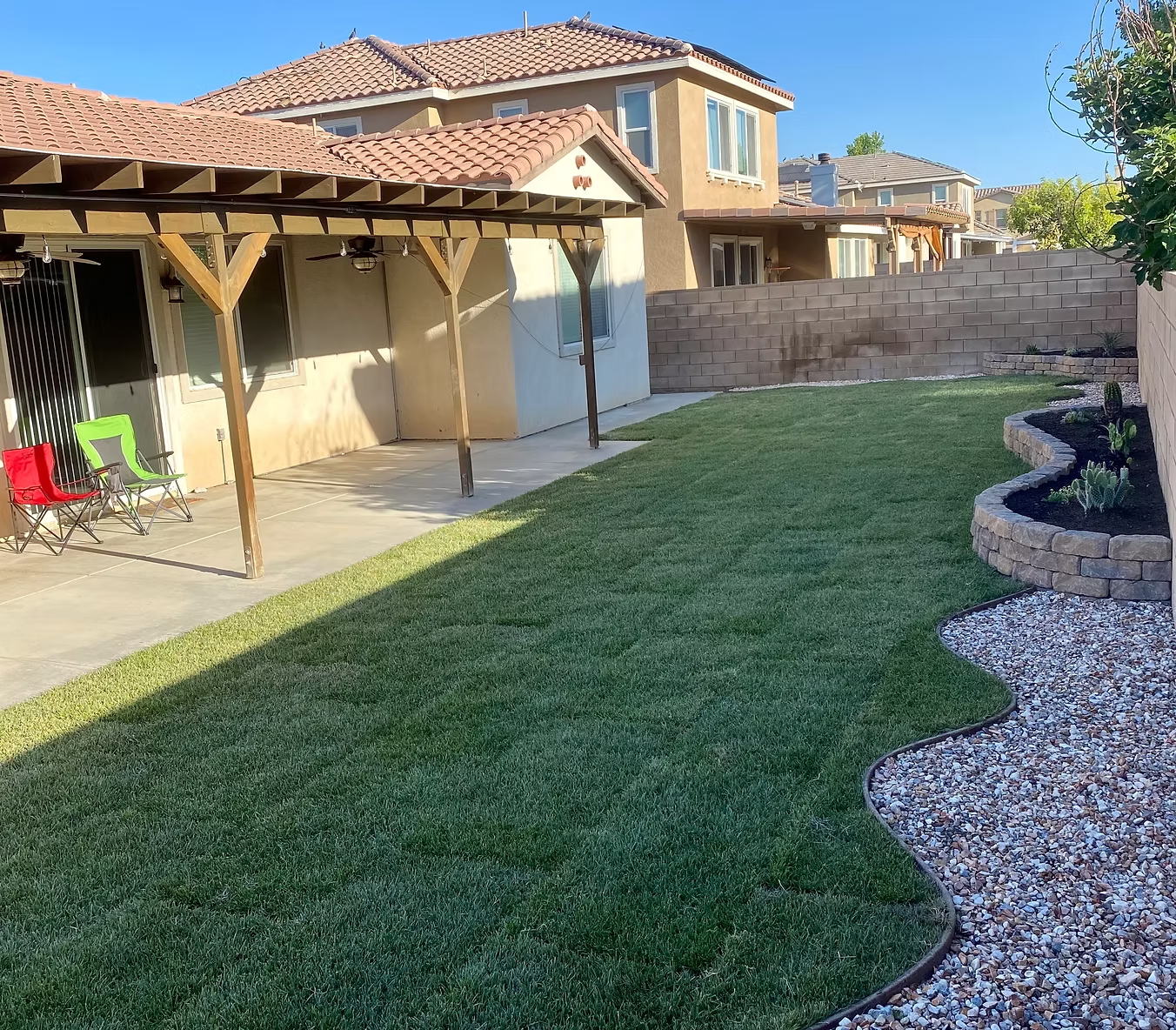 Sod installation with decorative rock border